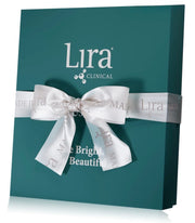 A teal Lira Clinical gift box tied with a white satin ribbon, shown on a clean white background with a soft reflection.